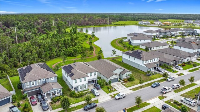 711 Steerview St, Saint Cloud, FL 34771 - aerial perspective of suburban area featuring a nearby body of water and a heavily wooded area