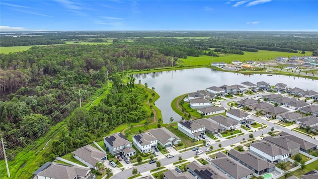 711 Steerview St, Saint Cloud, FL 34771 - aerial perspective of suburban area with a forest and a large body of water