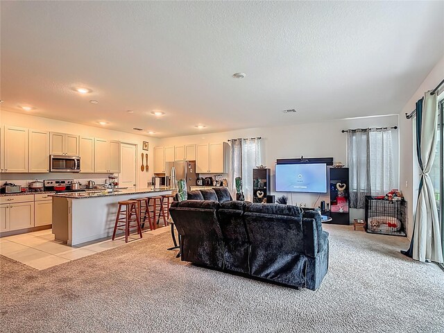 711 Steerview St, Saint Cloud, FL 34771 - living room with light carpet, recessed lighting, and a textured ceiling