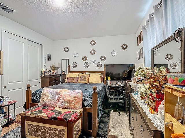 711 Steerview St, Saint Cloud, FL 34771 - bedroom with a textured ceiling and carpet floors