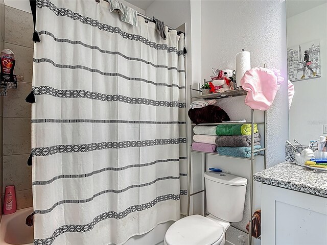711 Steerview St, Saint Cloud, FL 34771 - bathroom featuring shower / bath combo with shower curtain and a textured wall