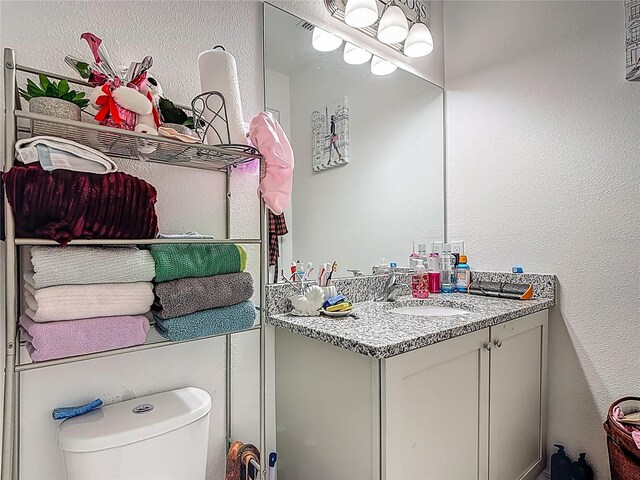 711 Steerview St, Saint Cloud, FL 34771 - bathroom featuring vanity and a textured wall