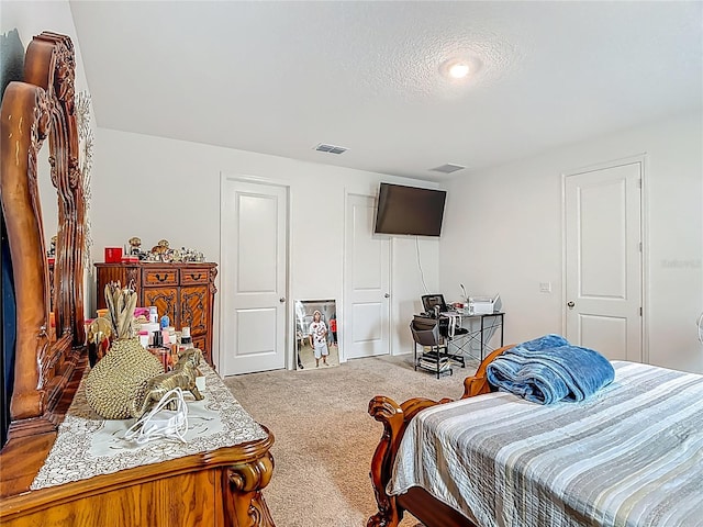 711 Steerview St, Saint Cloud, FL 34771 - carpeted bedroom featuring a closet and a textured ceiling