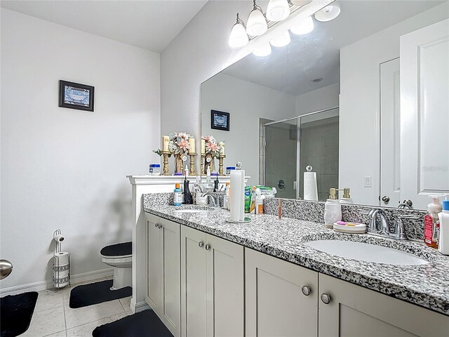 711 Steerview St, Saint Cloud, FL 34771 - bathroom with a stall shower, tile patterned flooring, and double vanity