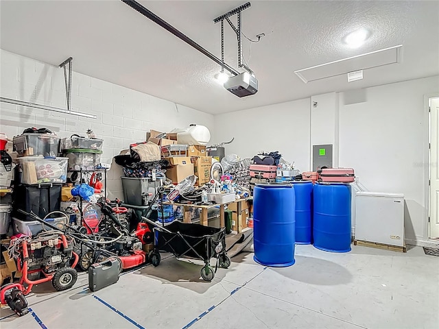 711 Steerview St, Saint Cloud, FL 34771 - garage featuring a garage door opener and concrete block wall