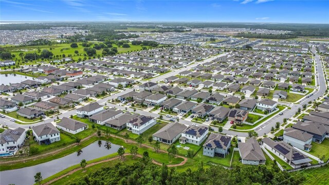711 Steerview St, Saint Cloud, FL 34771 - aerial view of property and surrounding area with a large body of water and nearby suburban area
