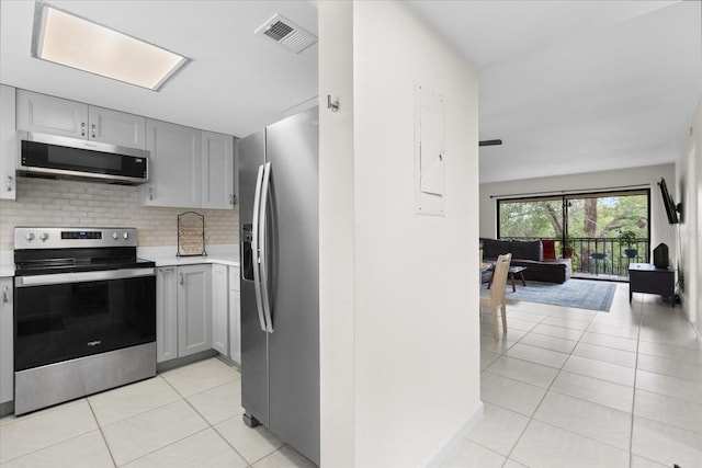 1036 Bonaire Dr Unit 2834, Altamonte Springs, FL 32714 - kitchen with appliances with stainless steel finishes, gray cabinets, light countertops, and light tile patterned flooring