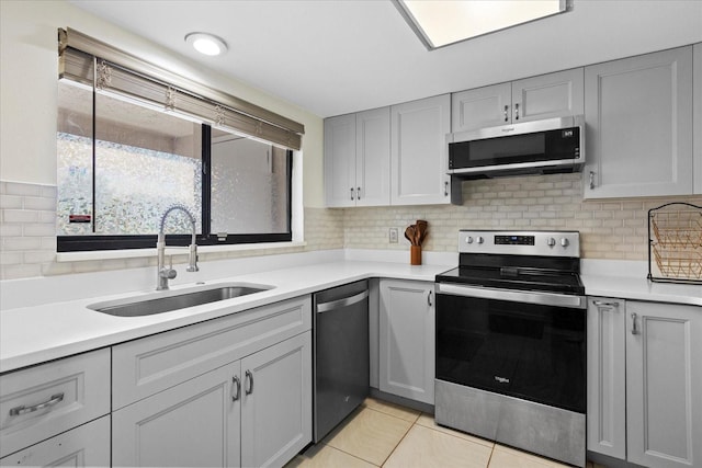 1036 Bonaire Dr Unit 2834, Altamonte Springs, FL 32714 - kitchen featuring stainless steel appliances, light countertops, and decorative backsplash