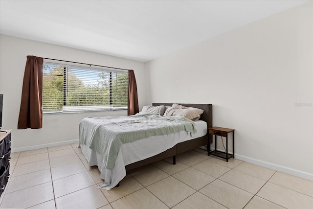 1036 Bonaire Dr Unit 2834, Altamonte Springs, FL 32714 - bedroom featuring baseboards and light tile patterned floors