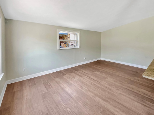 4233 Las Vegas Dr, New Port Richey, FL 34653 - unfurnished room with baseboards and wood finished floors