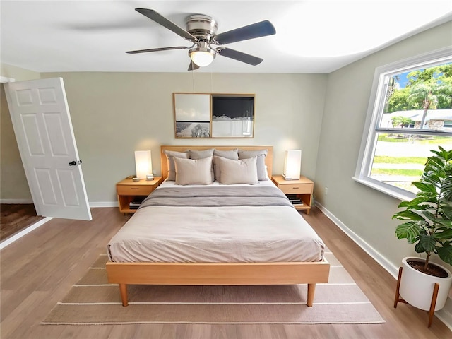 4233 Las Vegas Dr, New Port Richey, FL 34653 - bedroom with wood finished floors and a ceiling fan