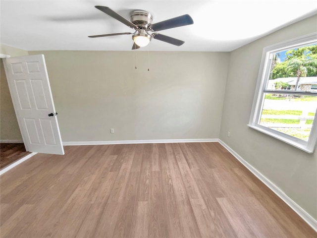4233 Las Vegas Dr, New Port Richey, FL 34653 - empty room with wood finished floors and ceiling fan
