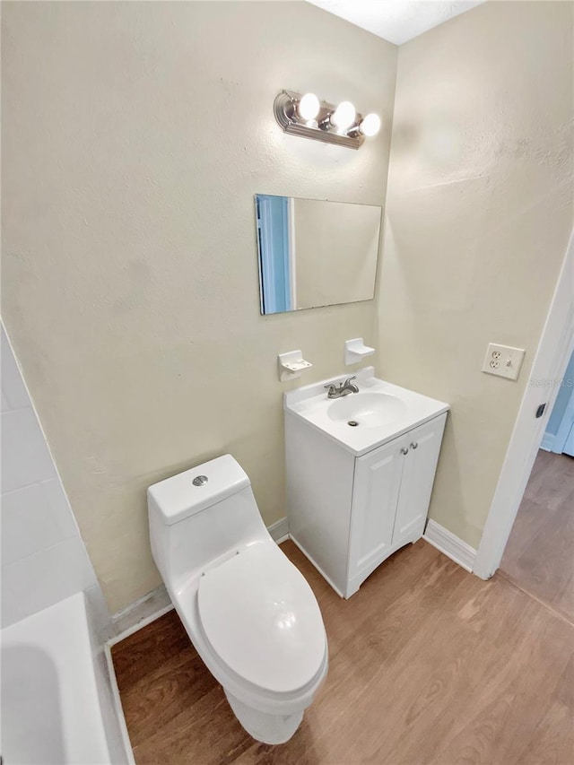 4233 Las Vegas Dr, New Port Richey, FL 34653 - bathroom with vanity, wood finished floors, and a bathtub