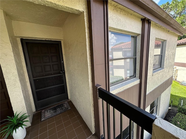 3279 Westridge Blvd Unit 204, Orlando, FL 32822 - doorway to property featuring stucco siding