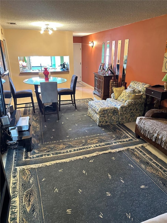 3279 Westridge Blvd Unit 204, Orlando, FL 32822 - carpeted living area with a textured ceiling