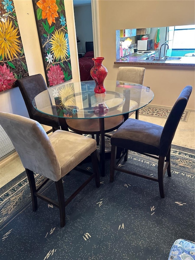 3279 Westridge Blvd Unit 204, Orlando, FL 32822 - carpeted dining space with a sink