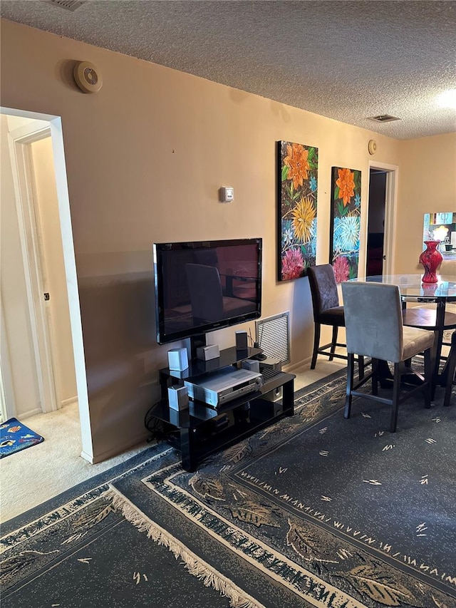 3279 Westridge Blvd Unit 204, Orlando, FL 32822 - living room featuring carpet and a textured ceiling