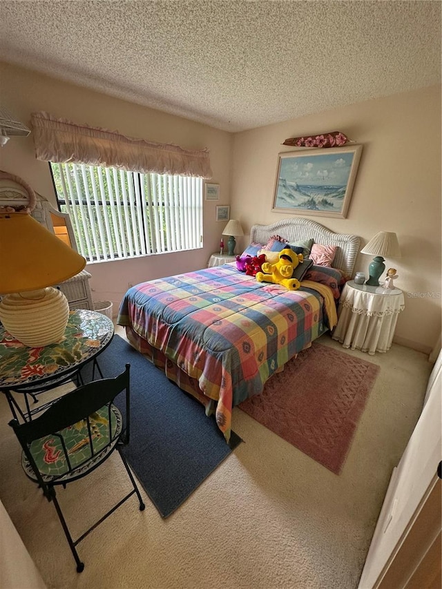 3279 Westridge Blvd Unit 204, Orlando, FL 32822 - bedroom featuring a textured ceiling and carpet flooring
