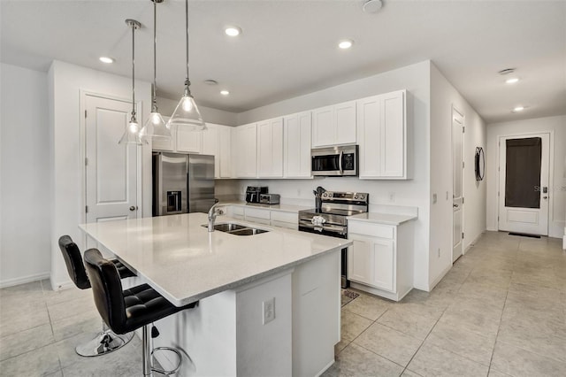 1056 Plantation Ln, Davenport, FL 33896 - kitchen featuring stainless steel appliances, light tile patterned flooring, a breakfast bar, recessed lighting, and light countertops
