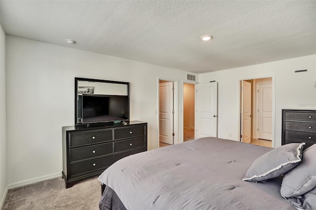 1056 Plantation Ln, Davenport, FL 33896 - bedroom with light carpet and a textured ceiling