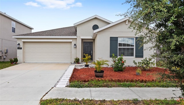 1291 Lassen St, Haines City, FL 33844 - view of front facade with an attached garage, stucco siding, and driveway