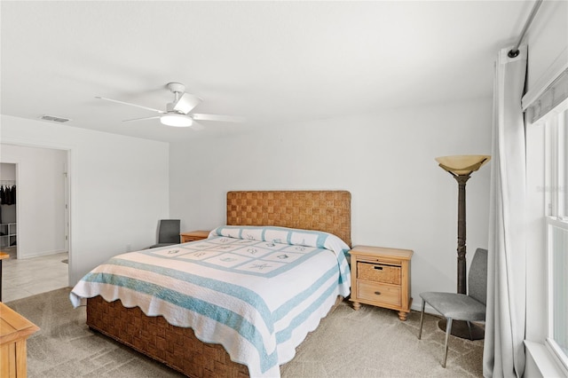 1291 Lassen St, Haines City, FL 33844 - bedroom with a ceiling fan and light colored carpet