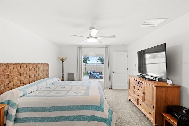 1291 Lassen St, Haines City, FL 33844 - bedroom with light colored carpet and a ceiling fan