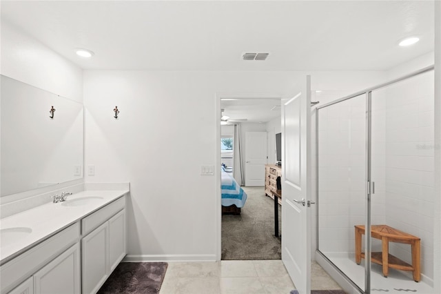 1291 Lassen St, Haines City, FL 33844 - ensuite bathroom with double vanity, a shower stall, tile patterned floors, recessed lighting, and a ceiling fan