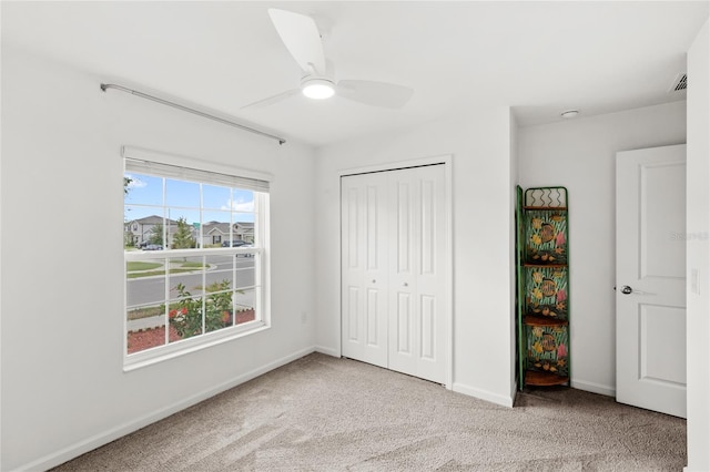 1291 Lassen St, Haines City, FL 33844 - unfurnished bedroom with carpet floors, a closet, and a ceiling fan