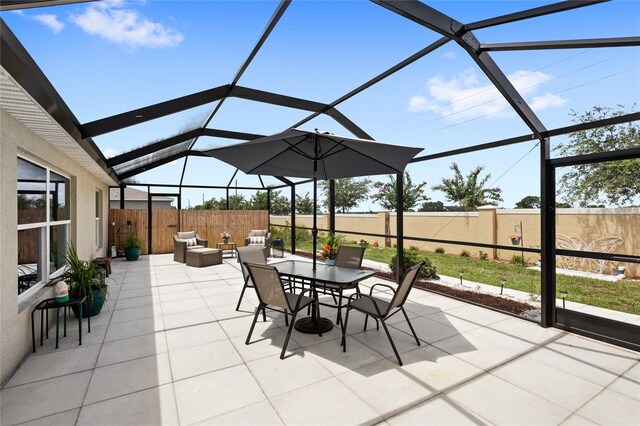 1291 Lassen St, Haines City, FL 33844 - fenced backyard with a patio, outdoor lounge area, and a lanai
