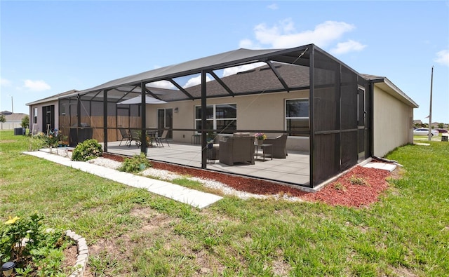 1291 Lassen St, Haines City, FL 33844 - back of house with a patio, a lawn, a lanai, and stucco siding