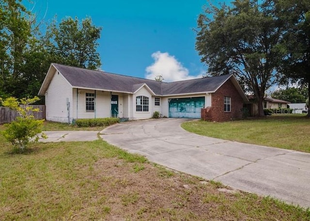 6140 SE 46th Avenue Rd, Ocala, FL 34480 - ranch-style house featuring driveway and a garage