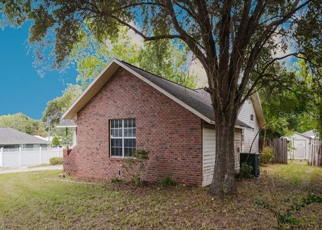 6140 SE 46th Avenue Rd, Ocala, FL 34480 - view of property exterior featuring brick siding and a storage shed