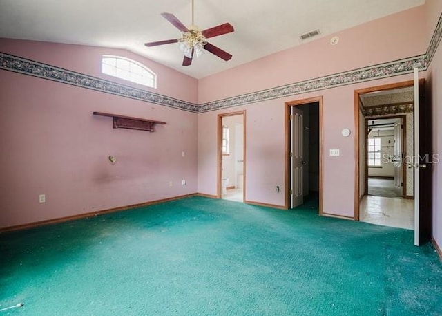 6140 SE 46th Avenue Rd, Ocala, FL 34480 - unfurnished bedroom featuring carpet flooring, vaulted ceiling, multiple windows, ensuite bathroom, and ceiling fan