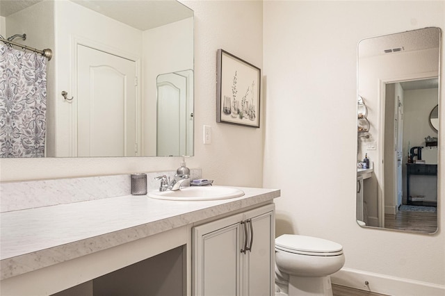 1668 Wilson Prairie Cir, Groveland, FL 34736 - full bathroom with vanity and wood finished floors