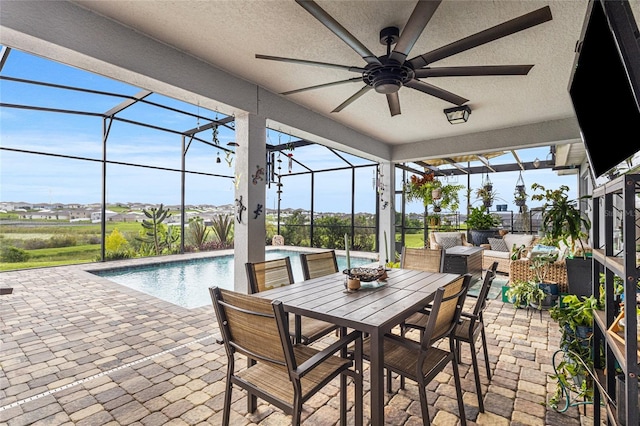 1668 Wilson Prairie Cir, Groveland, FL 34736 - sunroom with a ceiling fan, a swimming pool, and outdoor lounge area