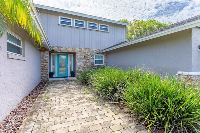 5361 Jade Cir, Belle Isle, FL 32812 - view of exterior entry featuring stone siding and stucco siding