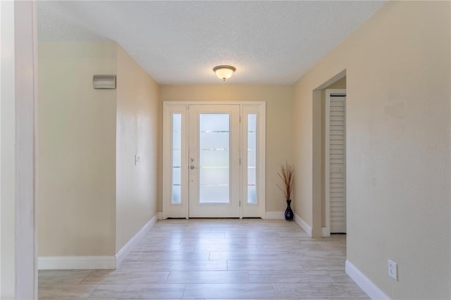 5361 Jade Cir, Belle Isle, FL 32812 - foyer entrance featuring a textured ceiling