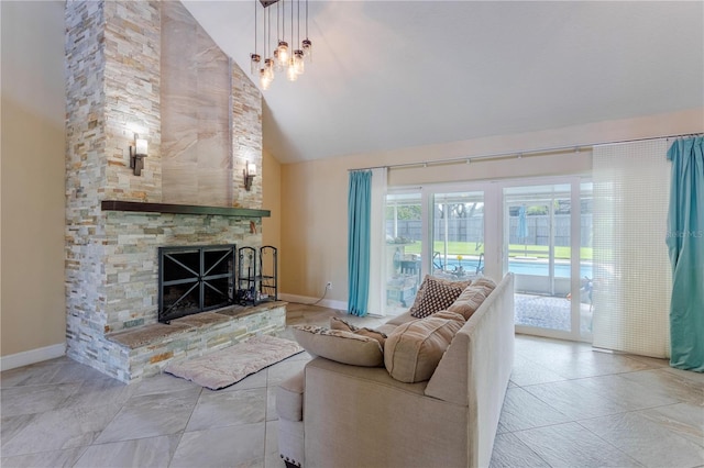 5361 Jade Cir, Belle Isle, FL 32812 - living room with a stone fireplace and high vaulted ceiling
