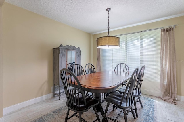 5361 Jade Cir, Belle Isle, FL 32812 - dining area with a textured ceiling and baseboards