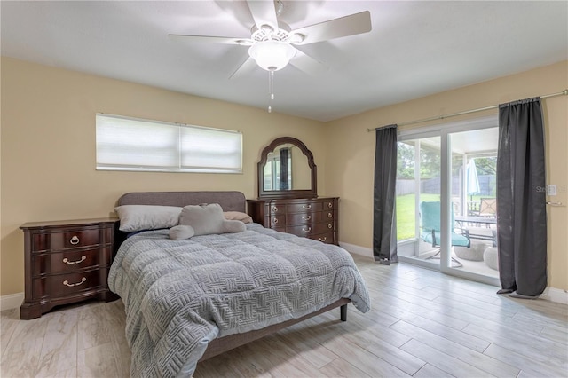 5361 Jade Cir, Belle Isle, FL 32812 - bedroom featuring access to exterior, light wood finished floors, and a ceiling fan