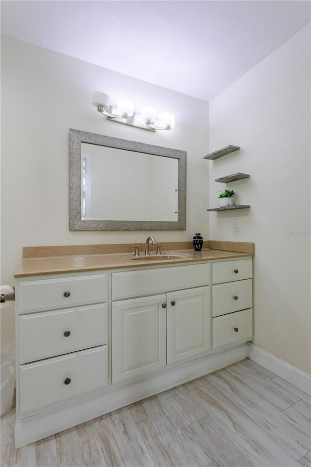 5361 Jade Cir, Belle Isle, FL 32812 - bathroom featuring vanity and baseboards