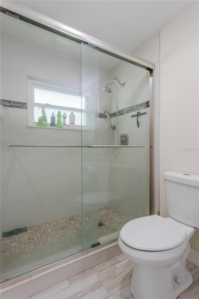 5361 Jade Cir, Belle Isle, FL 32812 - bathroom featuring toilet and a stall shower