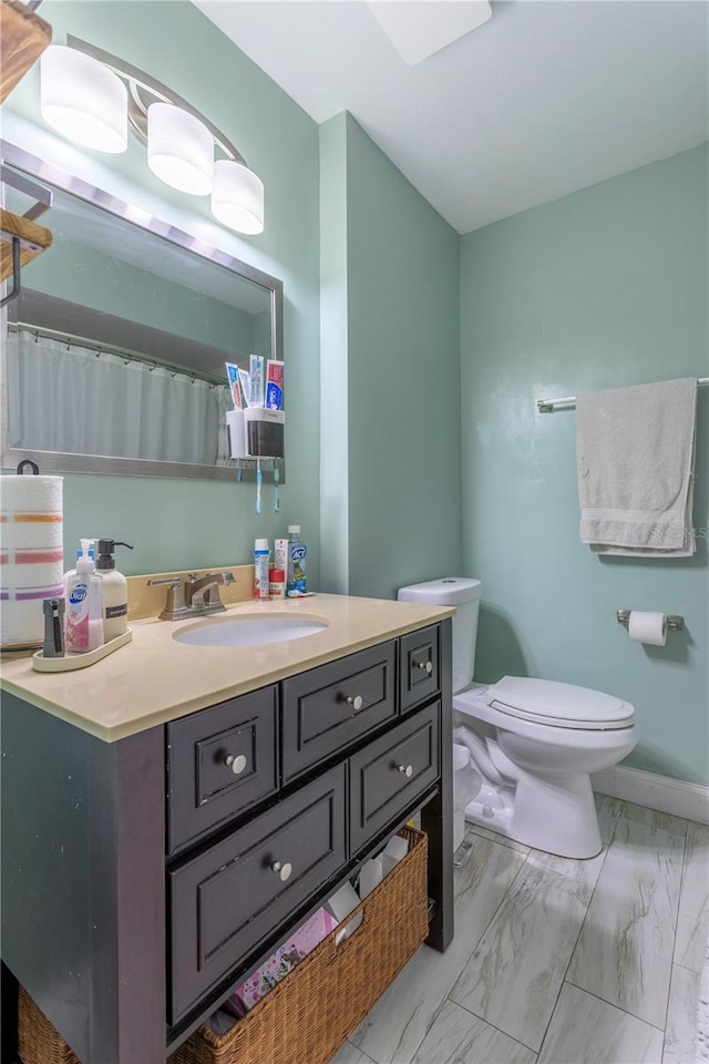 5361 Jade Cir, Belle Isle, FL 32812 - bathroom with marble look tiles and vanity