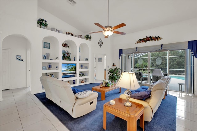 429 Belfry Dr, Davenport, FL 33897 - tiled living room featuring a ceiling fan, a sunroom, high vaulted ceiling, arched walkways, and built in features