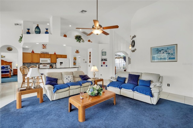 429 Belfry Dr, Davenport, FL 33897 - living room with ceiling fan, high vaulted ceiling, light tile patterned floors, light carpet, and recessed lighting