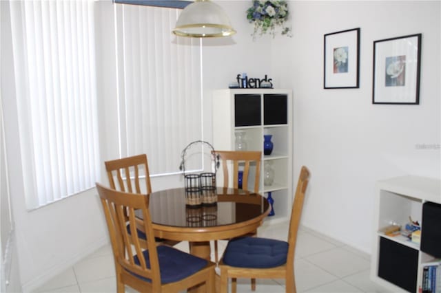429 Belfry Dr, Davenport, FL 33897 - dining area with tile patterned floors and baseboards
