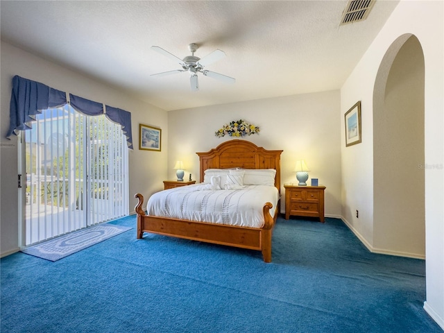 429 Belfry Dr, Davenport, FL 33897 - carpeted bedroom with access to exterior, ceiling fan, and arched walkways