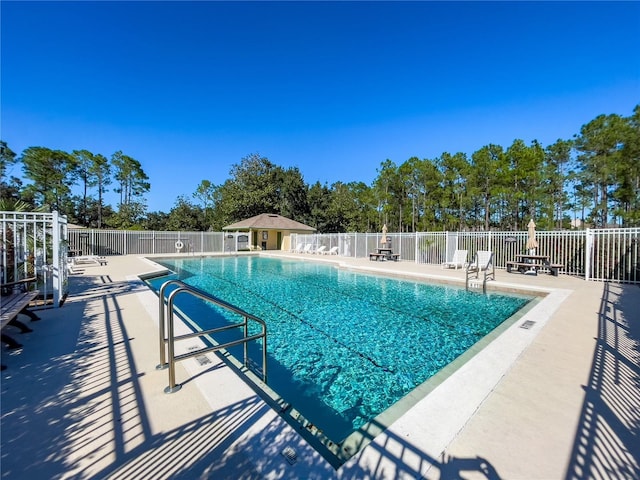 429 Belfry Dr, Davenport, FL 33897 - community pool with a patio area