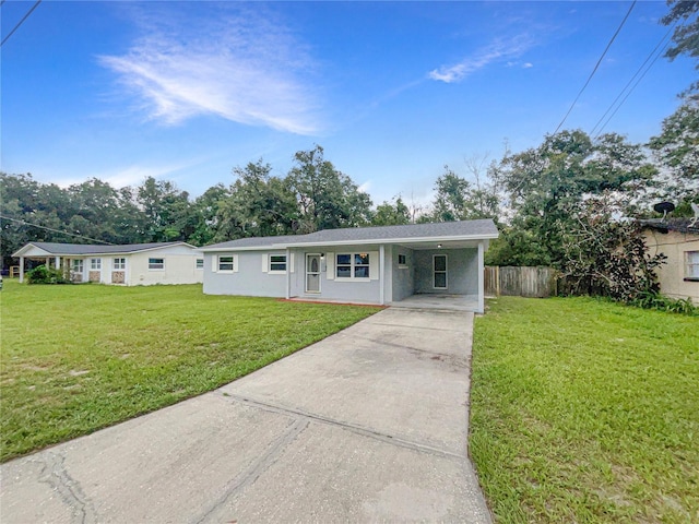 801 NE 4th Ave, Mulberry, FL 33860 - ranch-style house featuring concrete driveway, a carport, and stucco siding